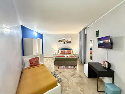 Letto o letti in una camera di Casa Raffinata