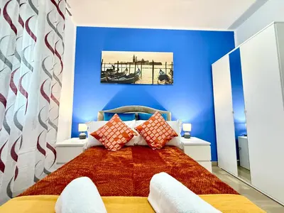 Letto o letti in una camera di Casa Raffinata