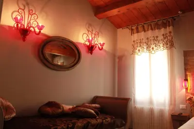 Letto o letti in una camera di Rosso Charm B&B
