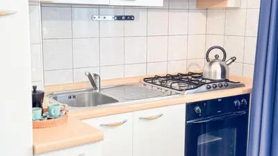 Cucina o angolo cottura di Liam Leo Suite by Ca-Sa Check