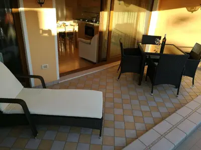 Area soggiorno di Apartment Nette Wohnung in Sottomarina mit Terrasse by Interhome