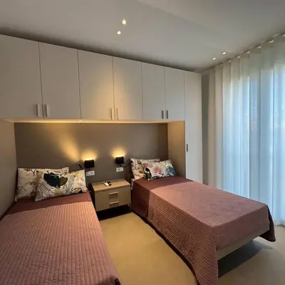 Letto o letti in una camera di A&G Elettra flat a pochi passi dal mare e Venezia