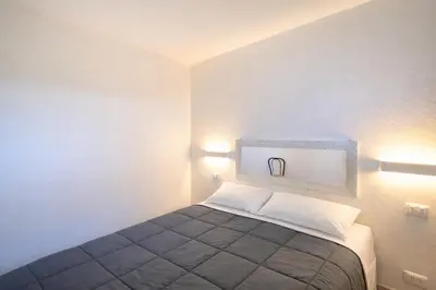 Letto o letti in una camera di Villa Patrizia