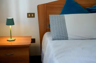 Letto o letti in una camera di Casa Delfina