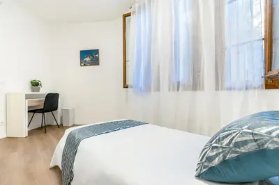 Letto o letti in una camera di Ipin Home