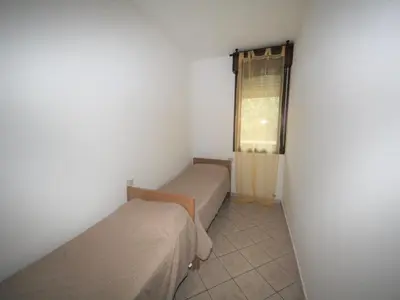 Letto o letti in una camera di 2 Bedroom Apartment in Viale dei Pini