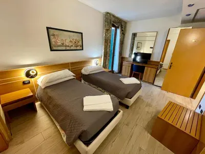 Letto o letti in una camera di Hotel Oasi