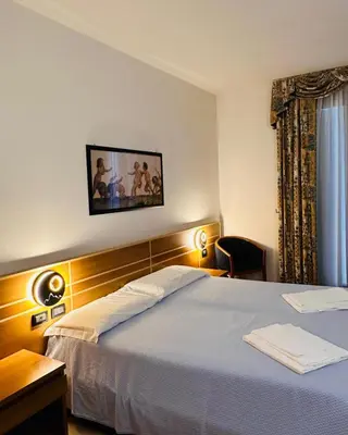 Letto o letti in una camera di Hotel Oasi