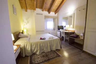 Letto o letti in una camera di Osteria Alla Pasina