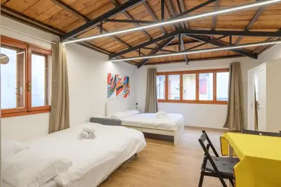 Letto o letti in una camera di GuestHost - Piazza della Frutta Studio Apartments