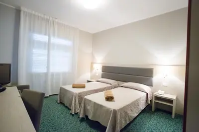 Letto o letti in una camera di Hotel Smeraldo