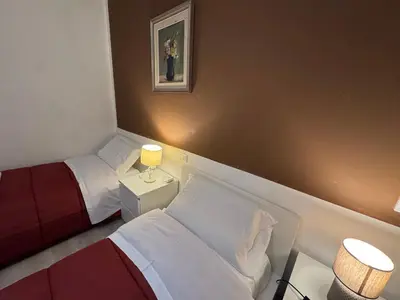 Letto o letti in una camera di Sun Moon Venice Harrysclass