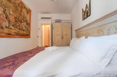 Letto o letti in una camera di VeNICe Cera Casa Del Sol