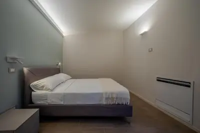 Letto o letti in una camera di La Cereria Design Flats - Il Cesellatore