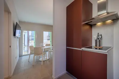 Cucina o angolo cottura di La Cereria Design Flats - Il Pelliciaio