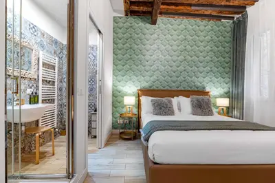 Letto o letti in una camera di Domus Emerald