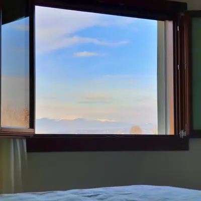 Letto o letti in una camera di Dai Freschi - Casa in campagna a Trevignano