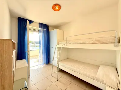 Letto o letti in una camera di Bafile 360-4 - Carraro Immobiliare - Family Apartments