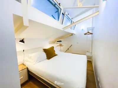 Letto o letti in una camera di CRISTAL House by Sleep in Murano