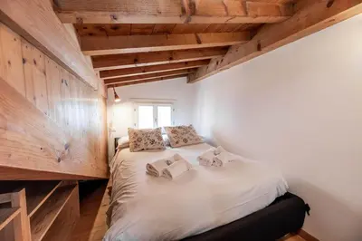 Letto o letti in una camera di Mansarda autentica a Castello, zona Biennale
