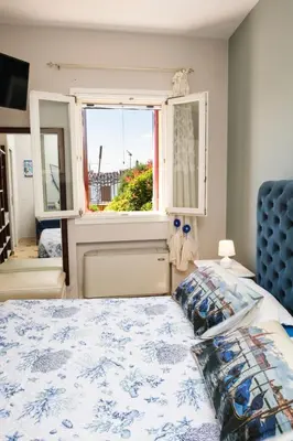 Letto o letti in una camera di Apartment Wohnung mit Meerblick by Interhome