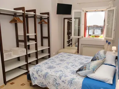 Letto o letti in una camera di Apartment Wohnung mit Meerblick by Interhome