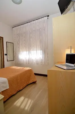 Letto o letti in una camera di Hotel San Giuliano