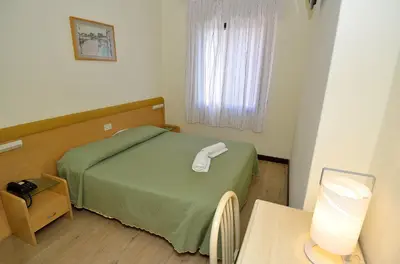 Letto o letti in una camera di Hotel San Giuliano