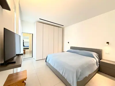 Letto o letti in una camera di Le Jolie - Carraro Immobiliare - Family Apartments