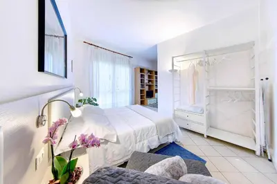 Letto o letti in una camera di Venice Lion Apartments, Comodi per Venezia e Jesolo