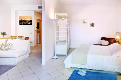 Letto o letti in una camera di Venice Lion Apartments, Comodi per Venezia e Jesolo