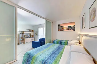 Letto o letti in una camera di Venice Lion Apartments, Comodi per Venezia e Jesolo