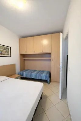 Letto o letti in una camera di BlueWave Jesolo