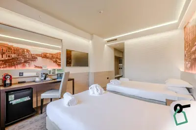 Letto o letti in una camera di Hotiday Venezia Marco Polo