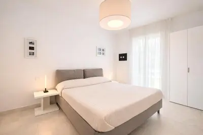 Letto o letti in una camera di Les Maisons - Carraro Immobiliare - Family Apartments