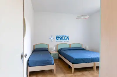 Letto o letti in una camera di Condominio Romeo