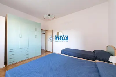 Letto o letti in una camera di Condominio Romeo