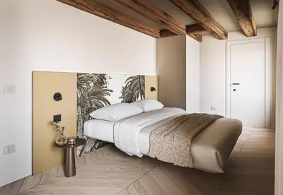 Letto o letti in una camera di Dimora Cadorin Apartments