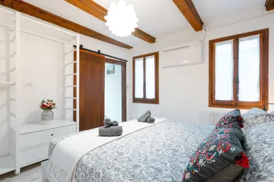 Letto o letti in una camera di Incantevole nido veneziano a 8 min da San Marco