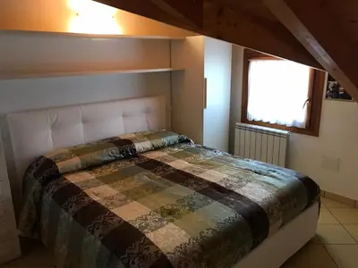 Letto o letti in una camera di Residence Solmare Quadrilocale
