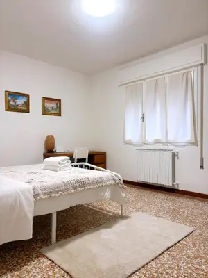Letto o letti in una camera di Terra Apartment Venice Mestre