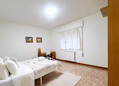 Letto o letti in una camera di Terra Apartment Venice Mestre