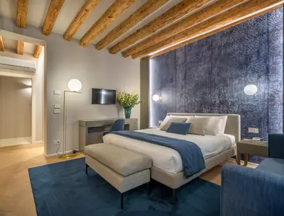Letto o letti in una camera di Palazzo Sarti Apartments R&R