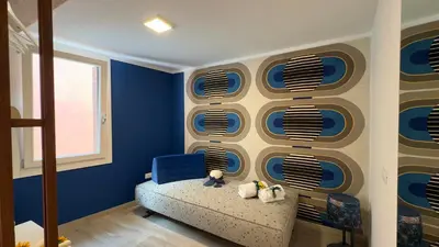 Letto o letti in una camera di Cà De La Corona EXPERIENCE