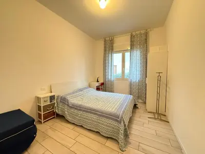 Letto o letti in una camera di VILLA GIULIA- Solo per Famiglie- WALTERIGATO APARTMENTS