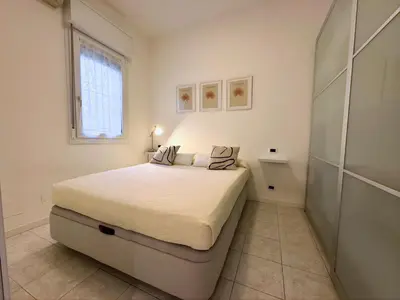 Letto o letti in una camera di Marina Marconi - Home immobiliare