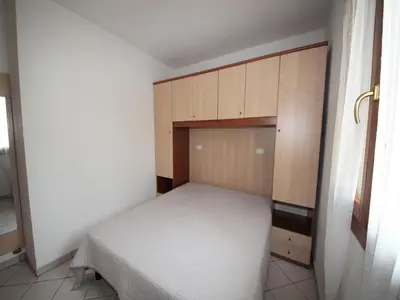 Letto o letti in una camera di Family stay in Rosolina for six guests