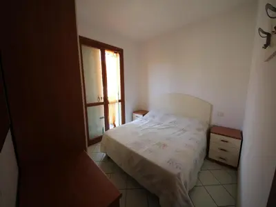 Letto o letti in una camera di Family stay in Rosolina for six guests
