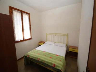 Letto o letti in una camera di Spacious Apartment in Rosolina Mare