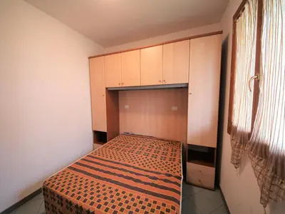 Letto o letti in una camera di Family stay in Rosolina Mare near sea